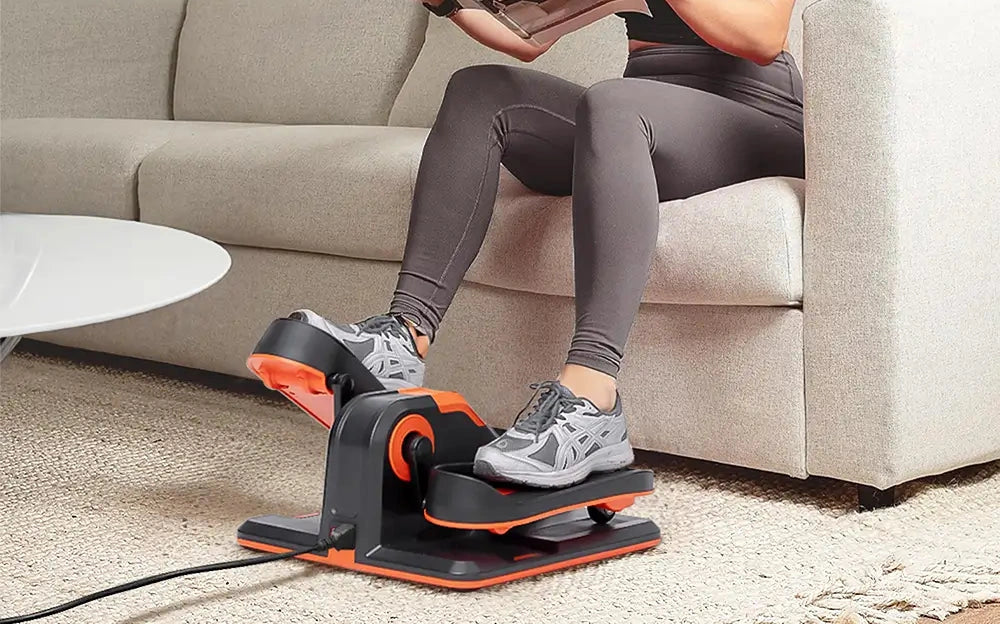 Using mini ellipticals while reading. This piece of workout equipment is on sale