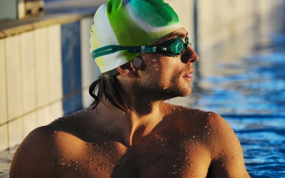 wearing Tousains bone conduction headphones underwater